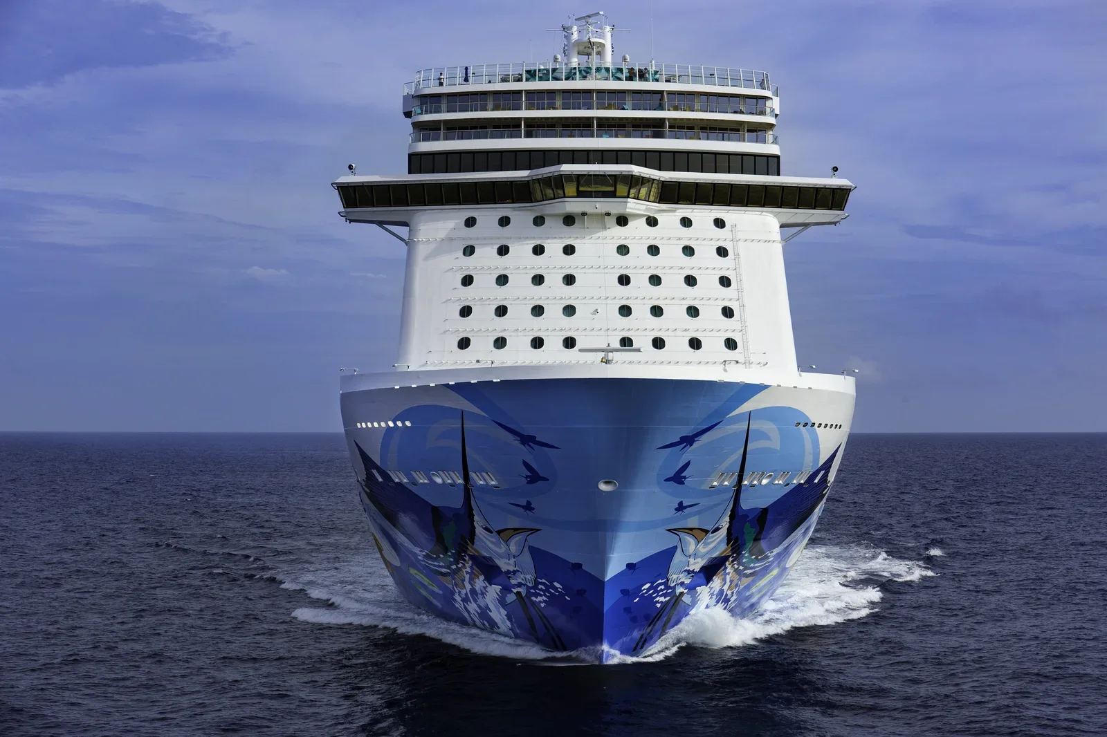 Norwegian cruise ship bow-on at Nassau, Bahamas, showing the line's signature hull artwork